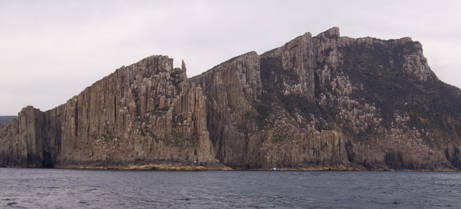 Coastal cliff sequence at Port Arthur, Tasmania, showing stacked sedimentary and dolerite units